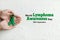 World lymphoma awareness day. Woman hands holds green ribbon on white background. September 15. Liver, Gallbladders bile