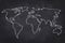 World map drawing on black chalkboard