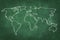 World map drawing on green chalkboard