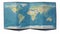 World map drawn on a folded sheet, planisphere leaning on a surface. Physical map