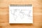 World map outline on notebook