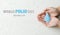 World Polio day. October 24. Blue drop in hands of an adult is symbol of polio vaccine. Poliomyelitis is disabling and