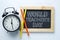World Teacher`s Day Text. Alarm Clock, Color Pencil and Blackboa