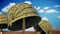 World War II helmets against blue sky. 3D illustration