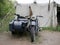 World war II motorcycle with sidecar and mounted ammunition boxes and mg-42 machine gun. German military motorcycle painted in dar