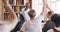 The world is wider to a curious mind. teenagers raising their hands in a classroom.