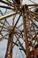 Worm's eye view of the internal workings of an abandoned ferris wheel at an abandoned amusement park
