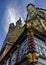 Worm`s eye-view of a lantern, a restaurant and a town hall in front of a blue sky in Germany