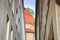 Worm's-eye view of narrow alley with Frauenkirche in Munich