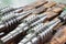 The worm shaft after processing lies on a wooden rack, the production of helically screw products
