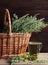 Wormwood blooming herb, absinth plant in a wicker on wooden rustic background