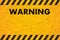 A worn black Striped Rectangle of yellow-orange color. Scratched warning sign. Vector illustration.