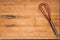 Worn Butcher Block Cutting Board with Wire Whisk