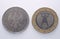 Worn coins, view of old 1 German mark on left and new 1 euro on right