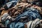 Worn dirty clothes or fabric in big pile for recycling or garbage. Generative AI