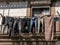 Worn jeans and pants drying outside old homes and apartments in downtown Porto