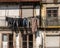 Worn jeans and pants drying outside old homes and apartments in downtown Porto