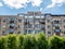 Worn out apartment building from the communist era against blue sky in Bucharest Romania