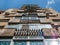 Worn out apartment building from the communist era against blue sky in Bucharest Romania