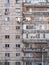 Worn out apartment building from the communist era against blue sky in Bucharest Romania. Ugly traditional communist housing