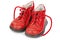 Worn out kiddie-size red lace-ups. Children`s shoes with laces. Old ankle boots for small kid