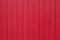 Worn rustic red barn board paneling texture