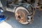 Worn rusty car brake disk. Repairing brakes on car