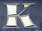 Worn, shabby letter `K` from the advertisement