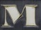 Worn, shabby letter `M` from the advertisement