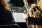 Worn wind instrument. Detail of a musician playing the tuba in a classical concert