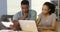 Worried African American couple looking through bills online