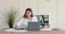 Worried business lady searching important documents on table