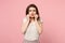 Worried displeased young woman in casual light clothes posing isolated on pink background studio portrait. People