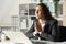 Worried executive with laptop praying at night at office