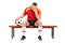 Worried football player sitting on a bench