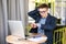 Worried freelance businessman running out of time watching the clock at office