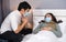 Worried husband take care his sick wife while she sleeping on bed at home, people must  be wearing medical mask protecting from