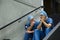 Worried male surgeons sitting on staircase