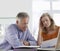 Worried Mature Couple With Bills At Dining Table