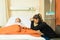 Worried Mother Sitting By Daughter At Hospital