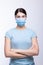 Worried nurse, doctor or scientist portrait behind facemask and protective glasses