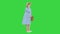 Worried Pregnant Woman Talking on the Phone having contractions on a Green Screen, Chroma Key.