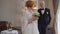 Worried redhead senior bride looking back at blurred groom turning looking at camera sighing. Portrait of anxious