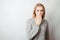 Worried shocked woman over empty white background