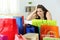 Worried shopaholic woman after multiple purchases