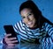 Worried unhappy young woman suffering from cyberbullying and harassment online by mobile phone