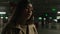 Worried upset woman Asian chinese korean japanese ethnic girl talking in dark car parking lot unhappy businesswoman talk