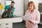 Worried Woman Looking At Bill In Veterinary Surgery