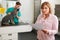 Worried Woman Looking At Bill In Veterinary Surgery