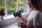 Worried Woman Looking At Smart Meter In Kitchen At Home During Cost Of Living Energy Crisis